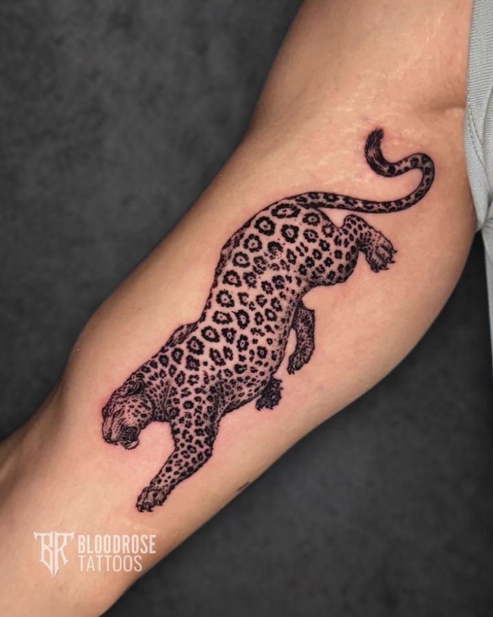 Detailed leopard tattoo on the forearm