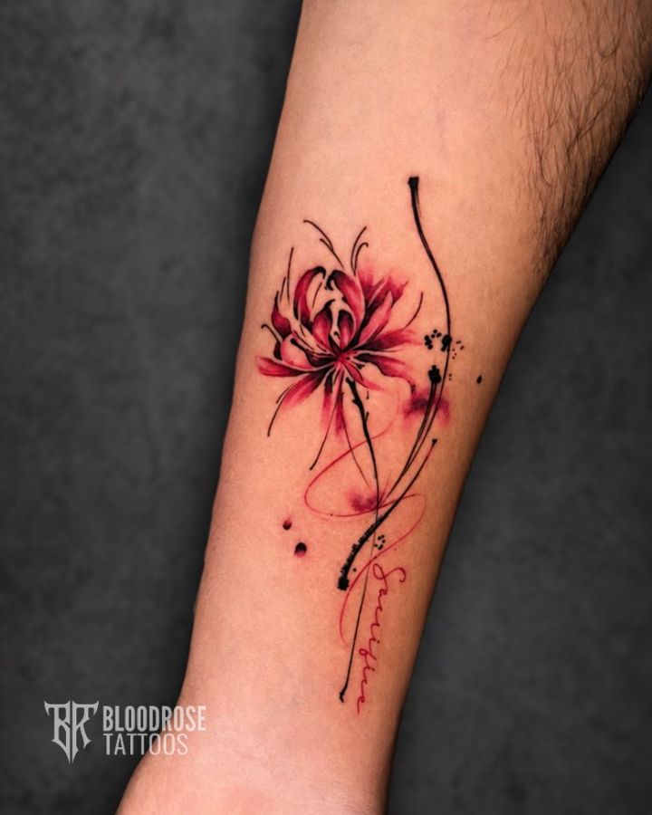 Fine-line floral tattoo with red accents