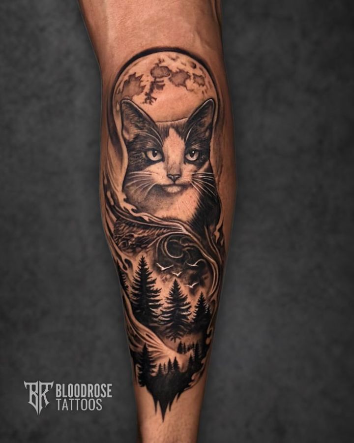 Black and grey realism tattoo with moon and forest